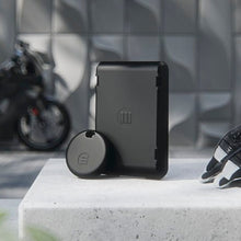 Load image into Gallery viewer, Monimoto GPS Anti-Theft Tracker On a table